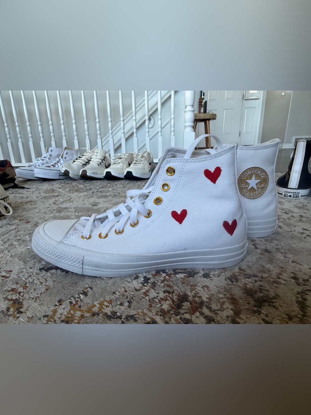 Converse White High-Top Sneakers with Red Heart Accents and Gold Eyelets
